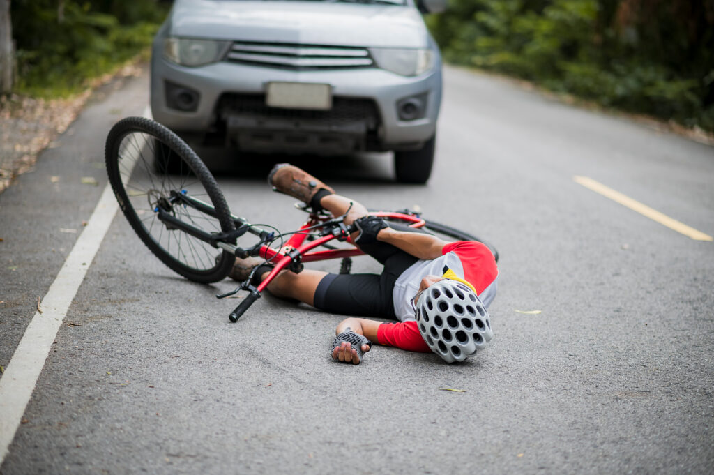 bicycle accident scene, injured bicyclist