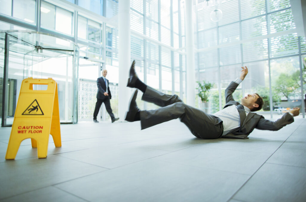 slip and fall personal injury case, man falling at his office on the slippery floor