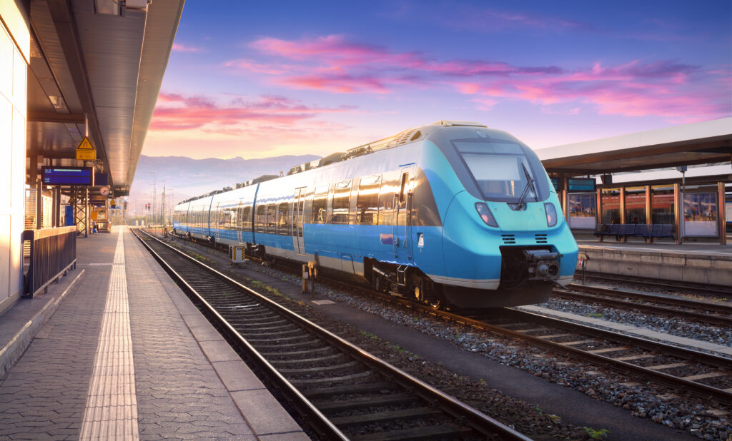 commuter train on railway platform.