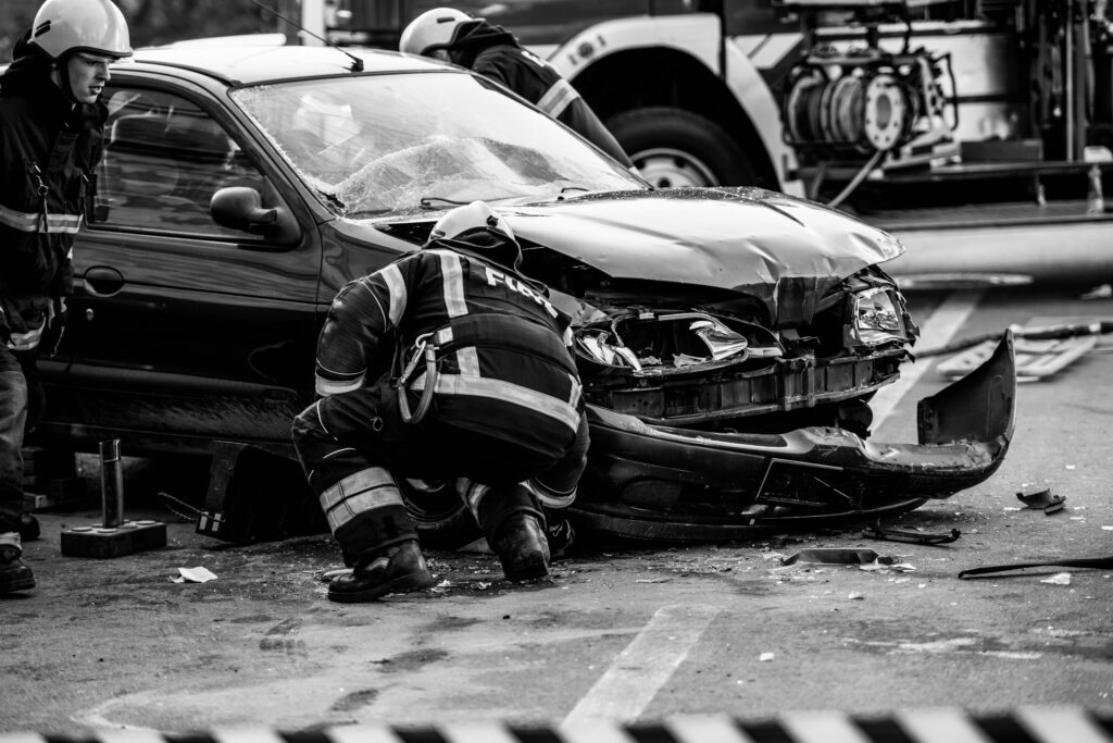 distracted driver car accident scene black and white