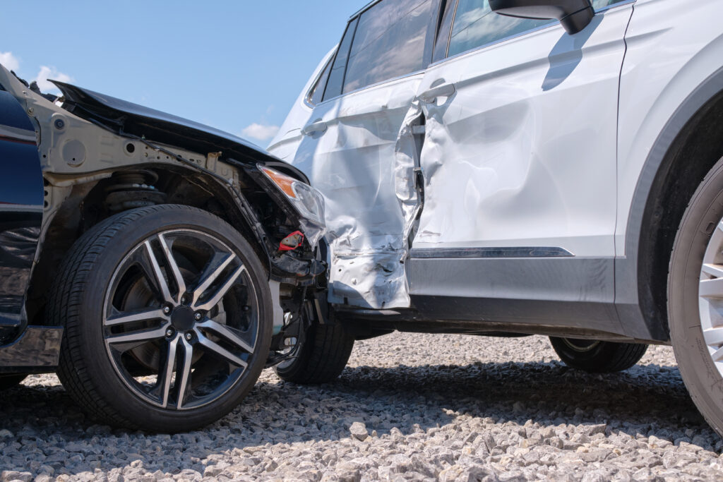 damaged cars in an intersection accident