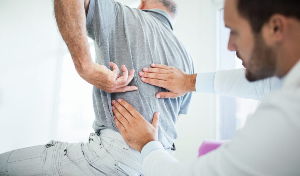 man with back pain following a car accident