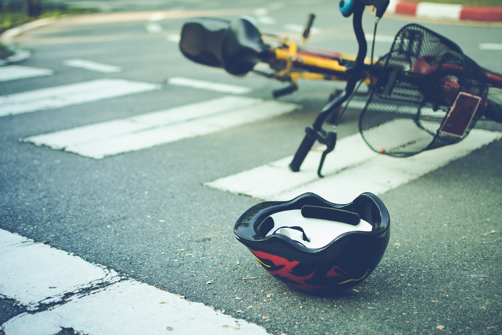 bicycle and helmet lying in the road after a bicycle accident
