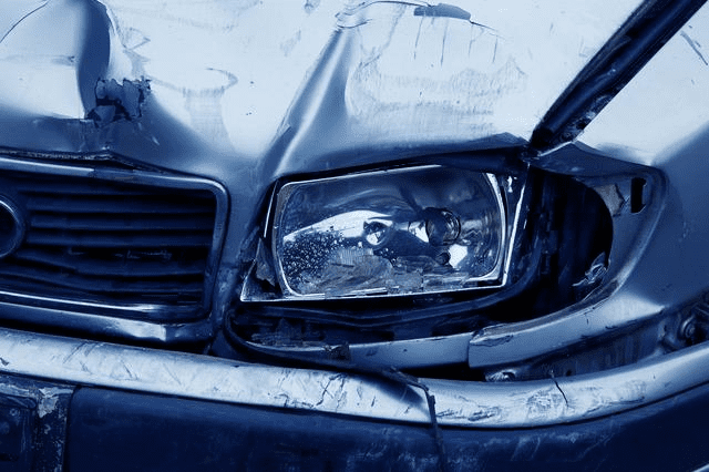 front of car damaged in a car accident in dc, insurance adjuster and medical expenses theme