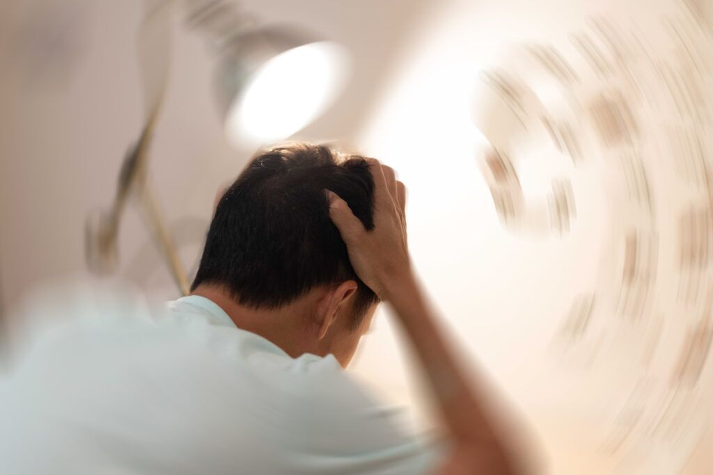 man with a headache and dizziness weeks after a car accident