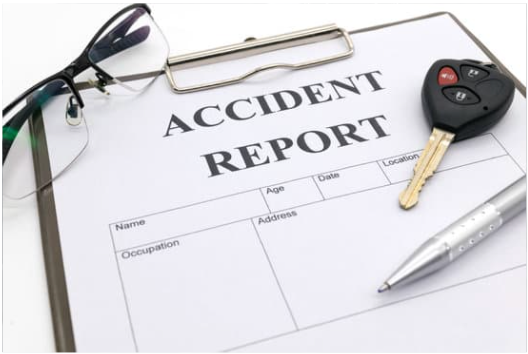 car accident report form on a clipboard
