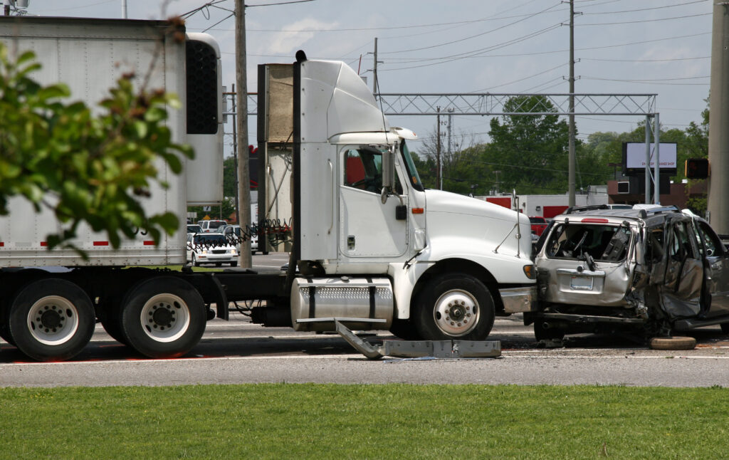 The scene of a fatal accident involving a semi-truck and a minivan.